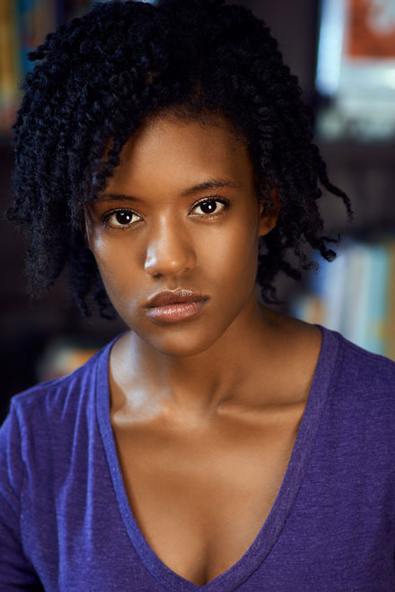 Dramatic headshot with film noir style lighting and intense facial expression