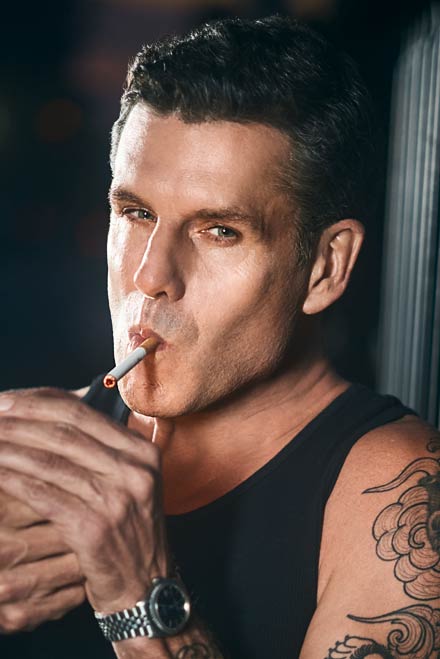 Actor lights cigarette and shows attitude