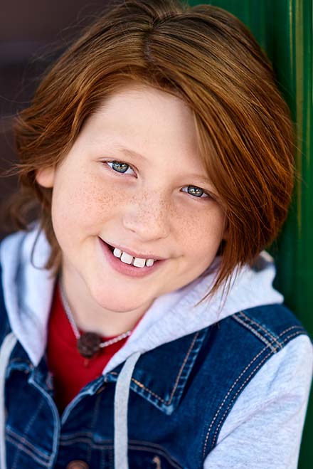 Heashot of child actor with red hair