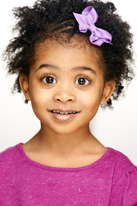 Headshot of child actor photographed in studio in Hollywood