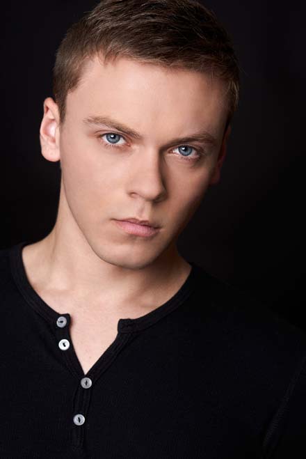 Dark and dramatic headshot of handsome male actor