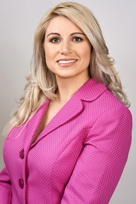 Headshot of attorney in front of grey backdrop